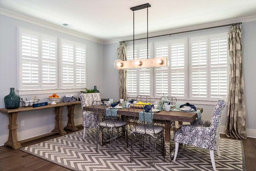 White Polywood shutters on large dining room windows