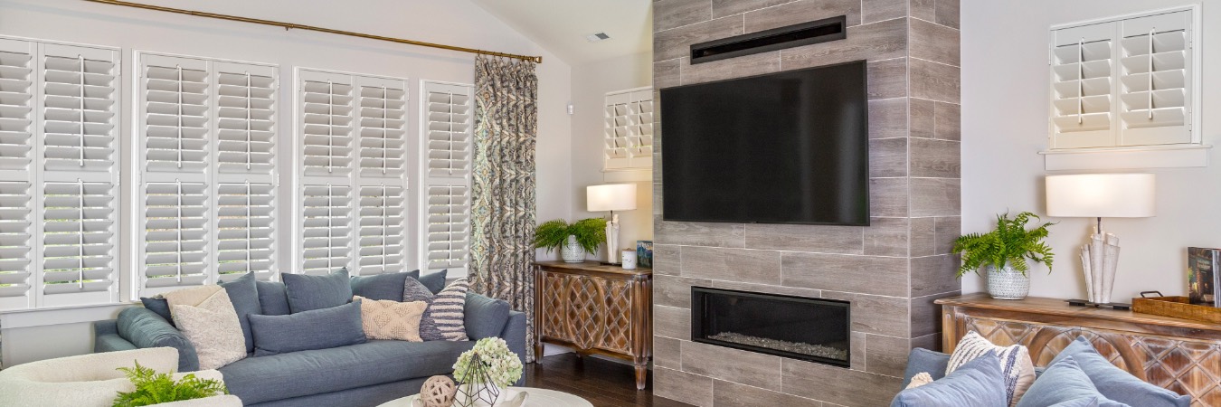 Plantation shutters in St. Hedwig living room with fireplace