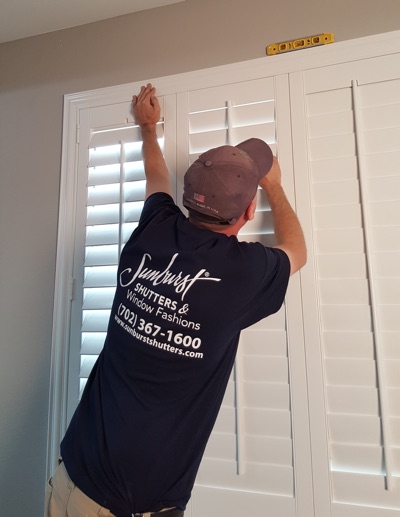 Shutter installation in San Antonio bedroom.