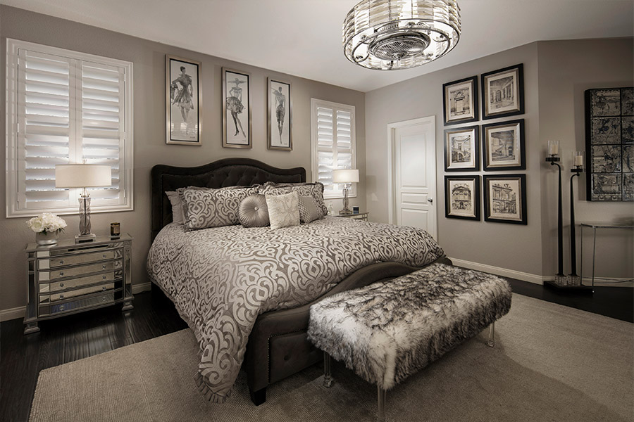 A wide-framed interior shutter can make those small windows look larger. large, luxurious bed in the middle of two smaller windows with white plantation shutters