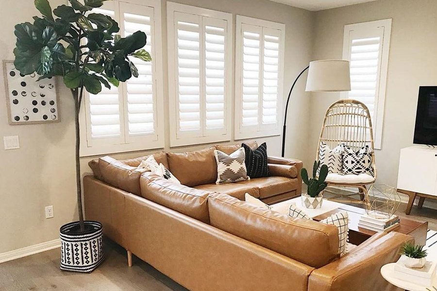 White Polywood shutters in a beige and brown living room