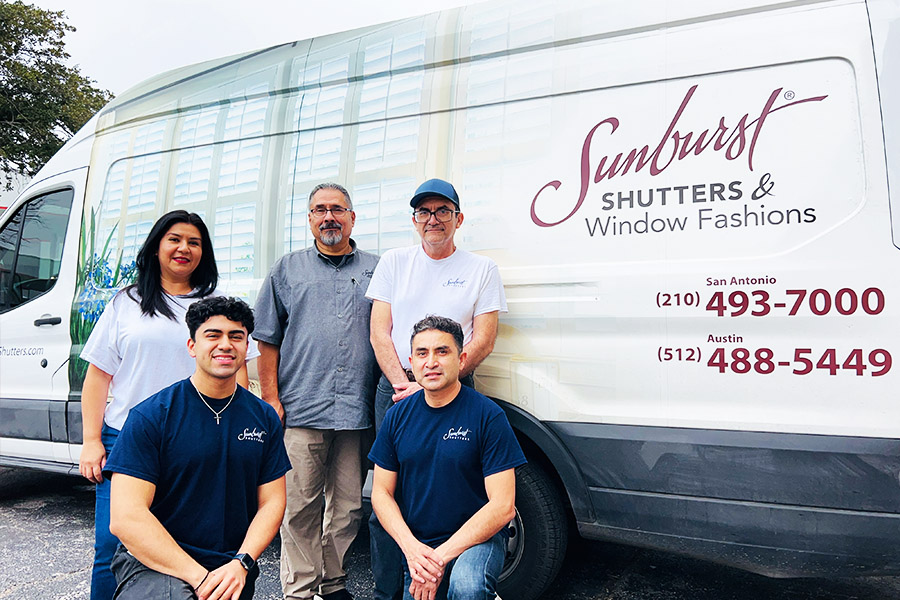 San Antonio group photo in front of the Sunburst company van