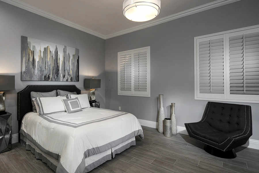Close your custom Polywood shutters to beat the heat and keep your San Antonio bedroom cool. White Polywood shutters on bedroom windows