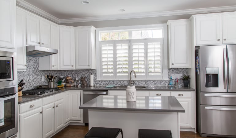 Polywood® plantation shutters resist heat and moisture in your kitchen. Polywood shutters in a San Antonio gourmet kitchen.