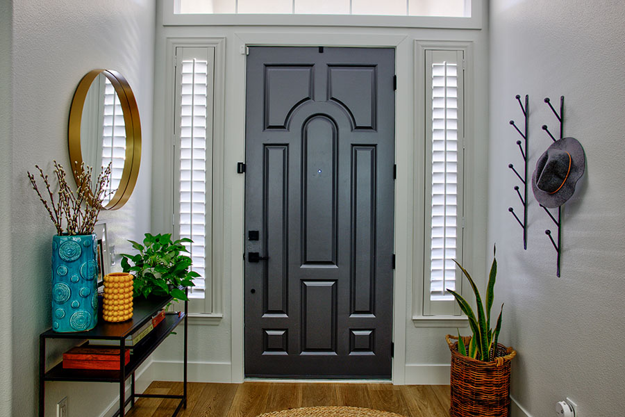 No matter the size or shape of your windows, interior shutters come custom-built to fit perfectly. Polywood shutters on skinny sidelight windows by a front door