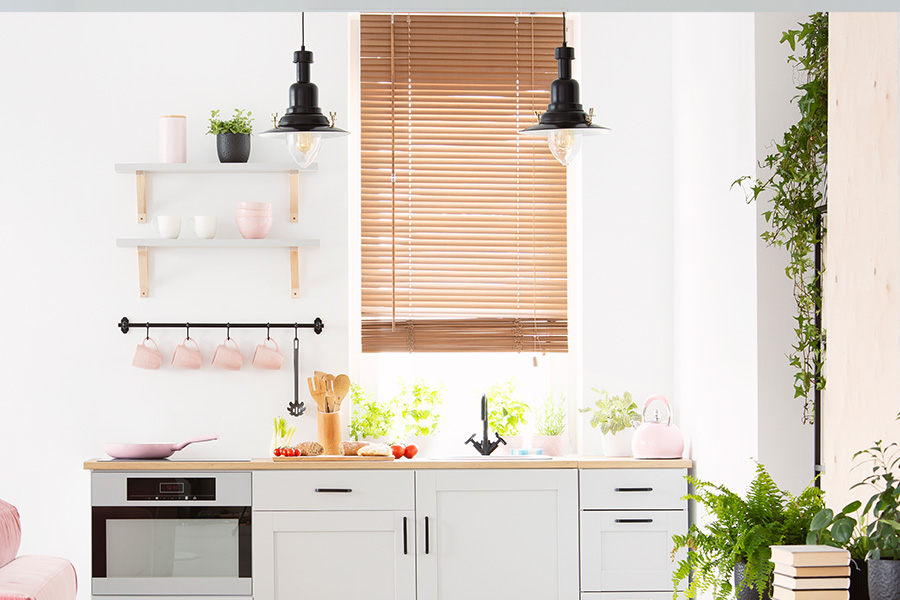 Natural wood blinds highlight your living space.  Beautiful and timeless white Polywood blinds are the perfect touch for your bathroom.