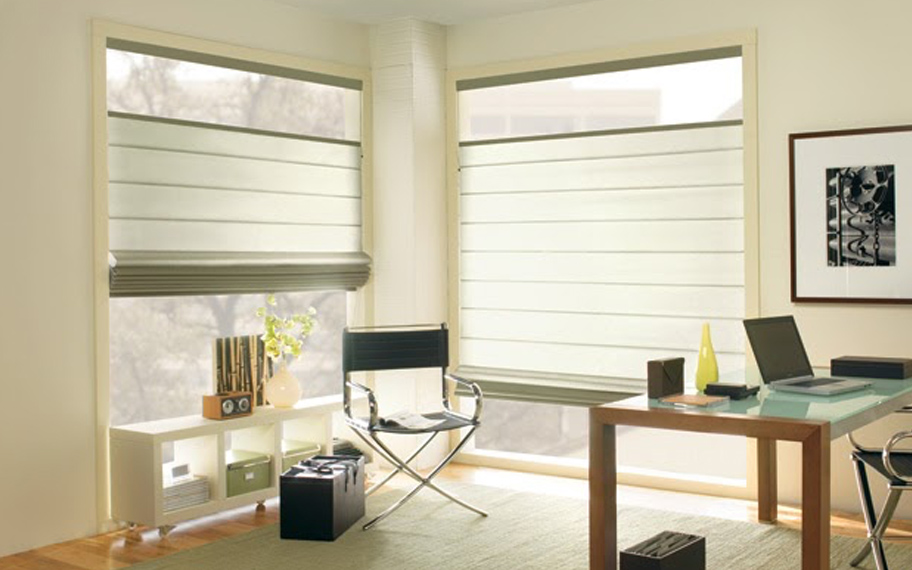 Upgrade your windows with stylish window shades or shutters in San Antonio. Stylish sheer shades in the corner of a modern office.